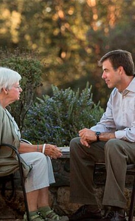 woman sitting and talking with Craig Hamilton